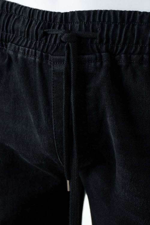 Card slide image -  JOGGER DE MOVIES NEGRO PARA HOMBRE